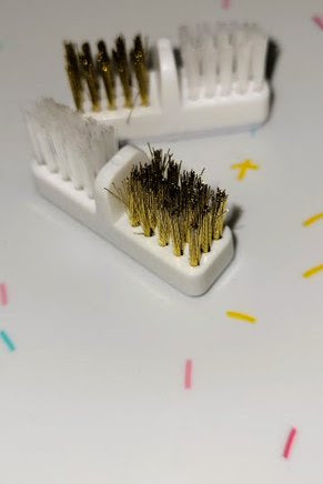 Metal and plastic brush.